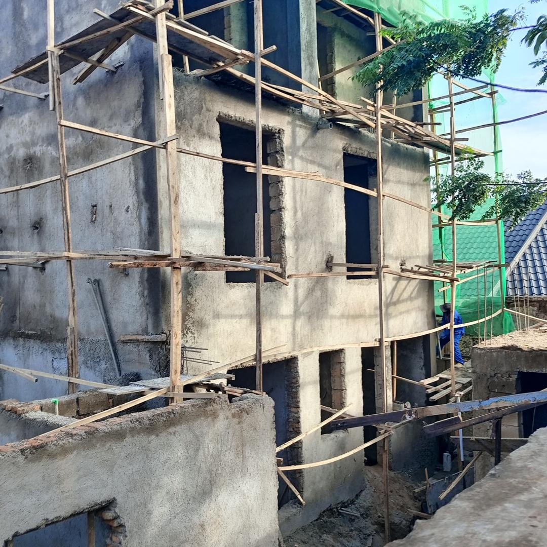 Plastering work on a house under construction in Kigali Rwanda