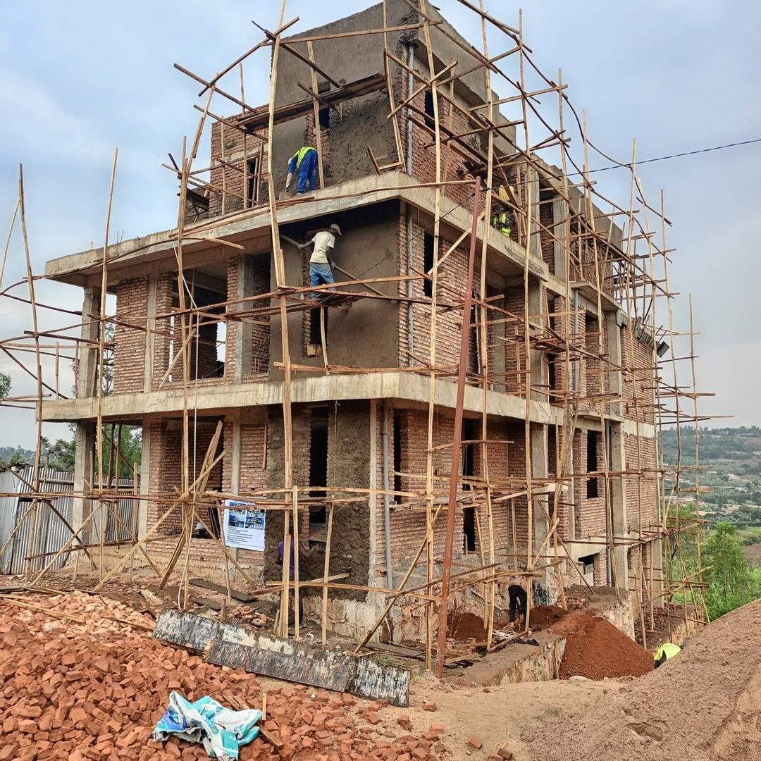 Brick house under construction with scaffolding in Kigali Rwanda